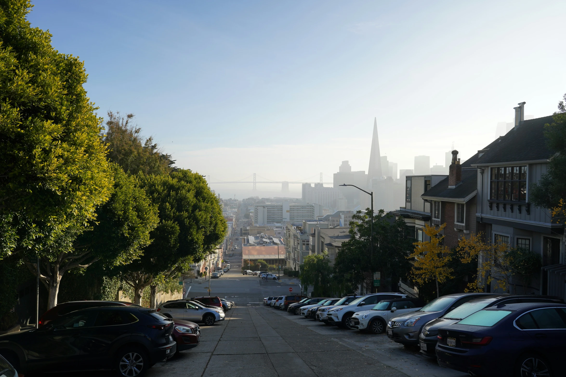 a view down a road of some very pretty tall buildings