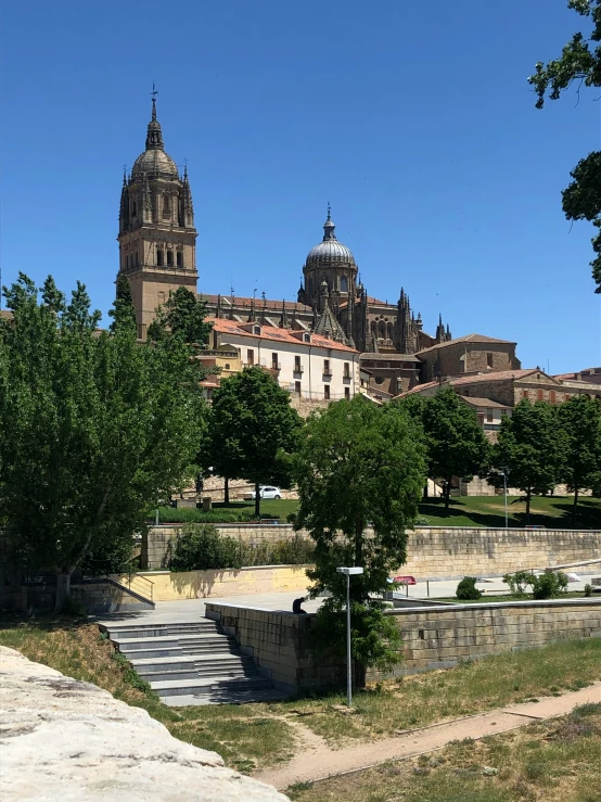 the large building has many towers and domes on it