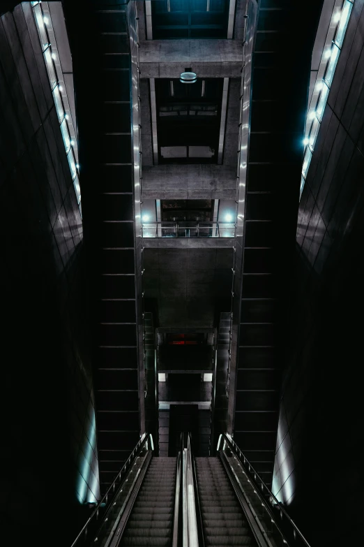 a view from the ground, looking down on a walkway in a building