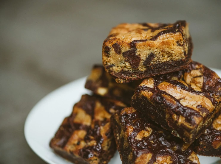 a bunch of cookies sitting on top of a white plate