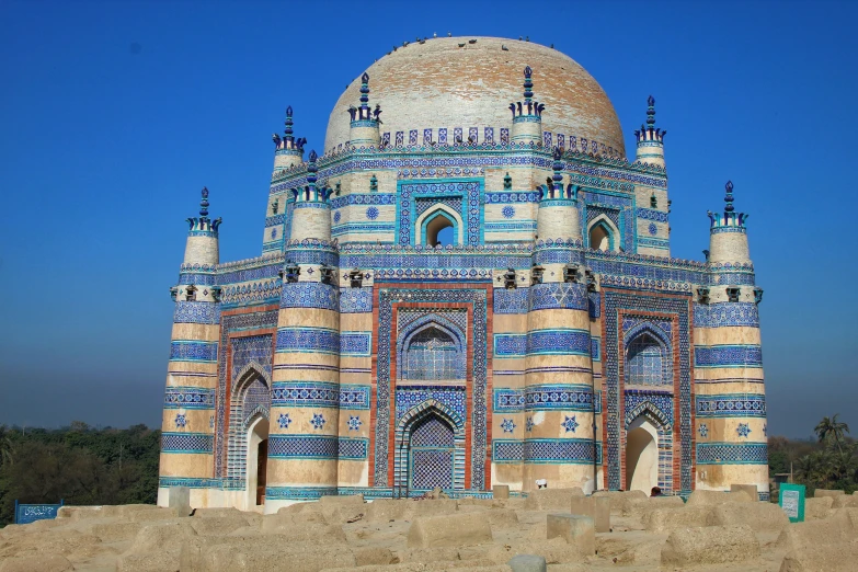 a large ornate building with blue and white decorations on it