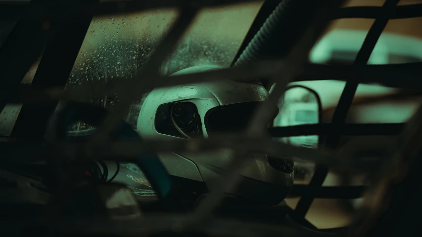 a car dashboard with a view through some bars