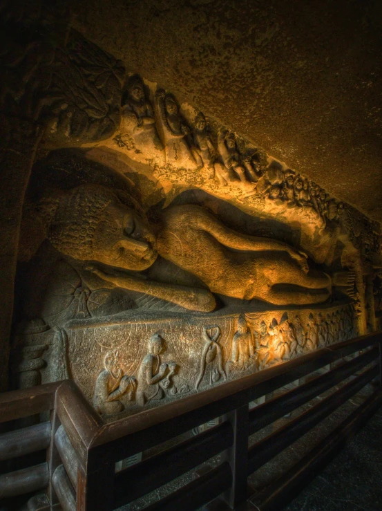 a carved stone artwork in a dark tunnel