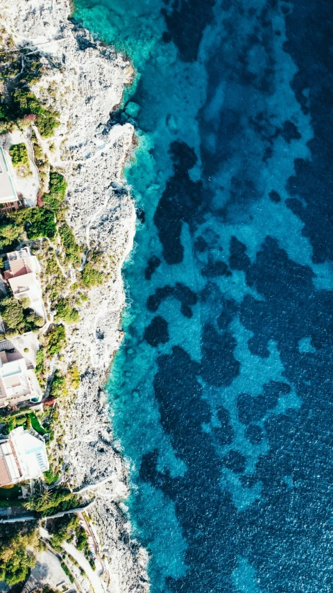 a view from above shows blue water and coastline