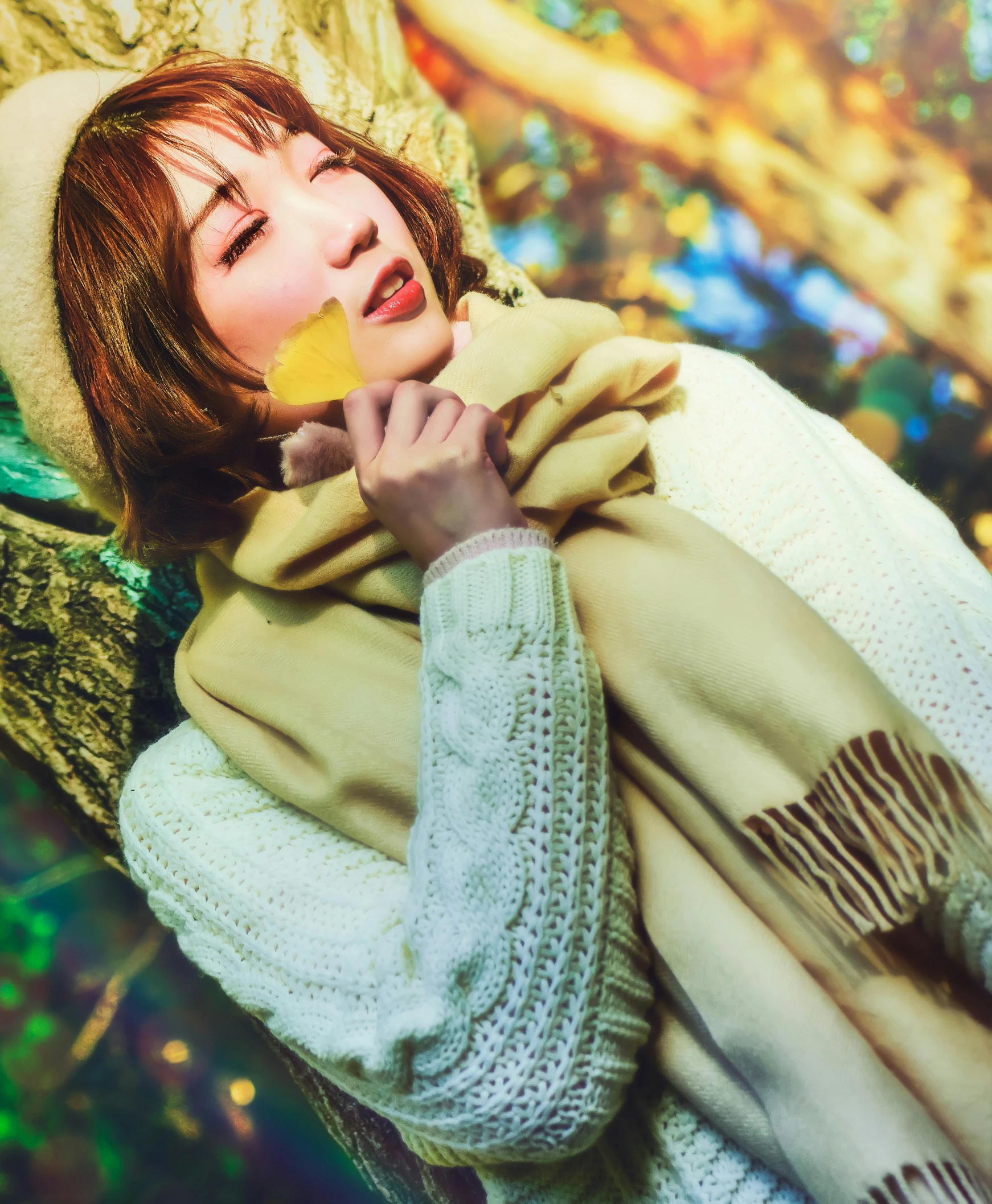 a girl holds an orange near her mouth