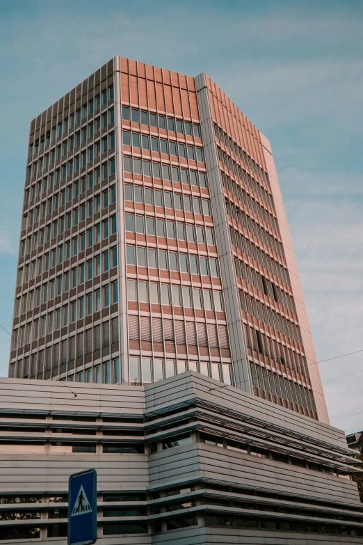 the large building is red and has many windows