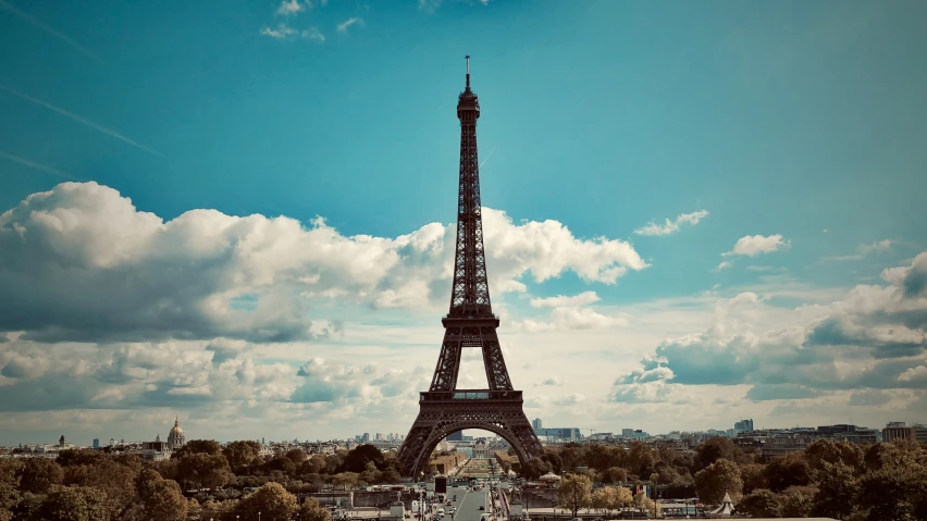 the eiffel tower is in paris on a beautiful sunny day