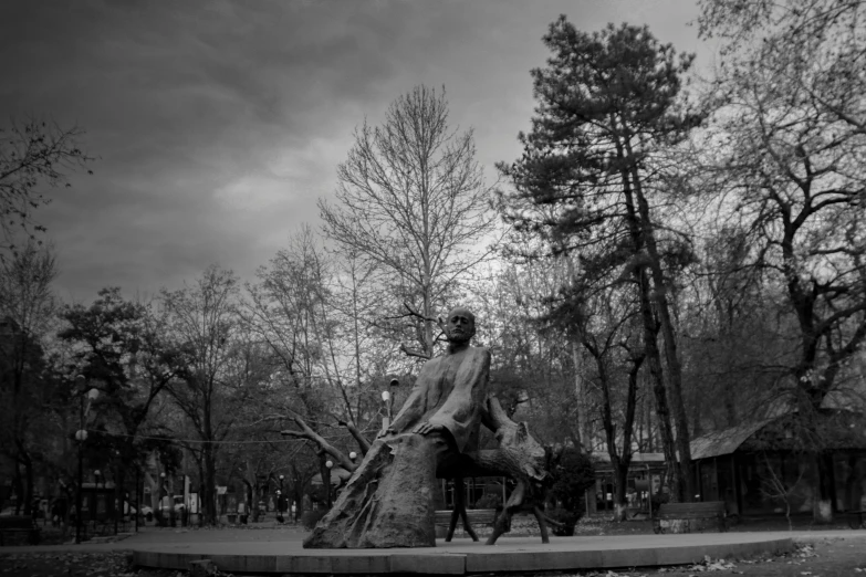 black and white po of a man walking with his horse