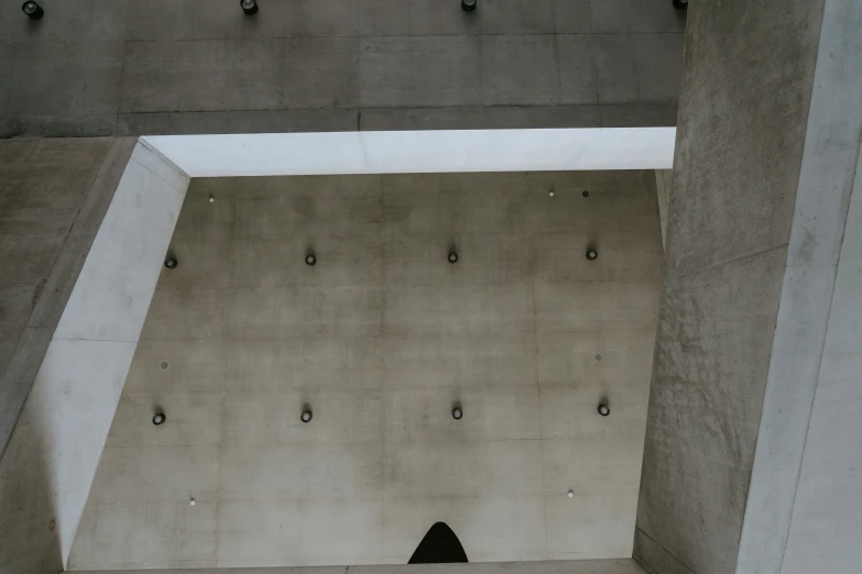 a large concrete area has studded cement and metal