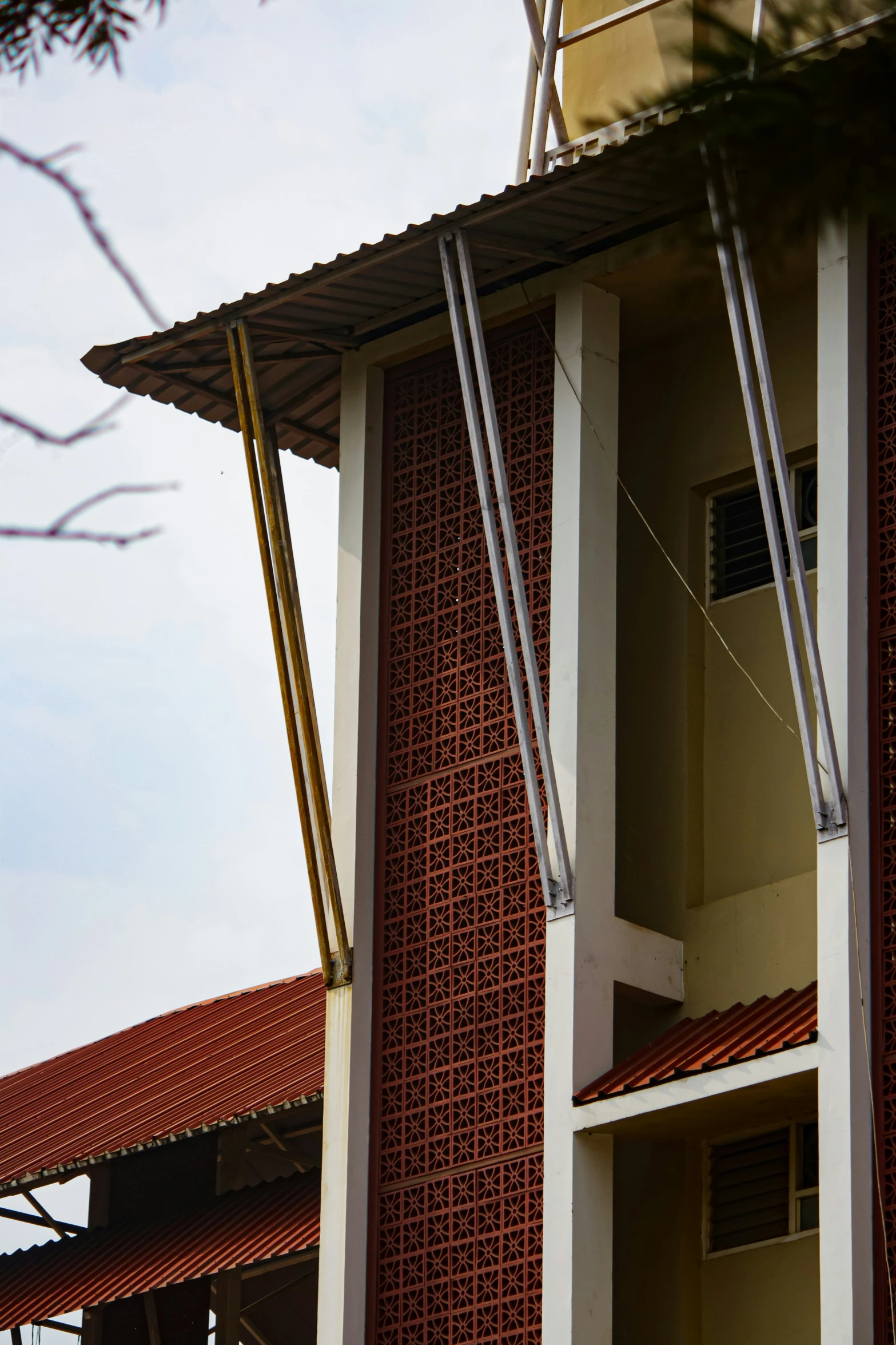 a large white clock hanging on the side of a red brick building