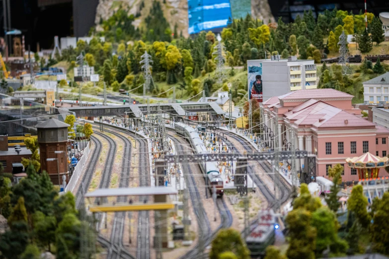 many small train tracks in front of some buildings