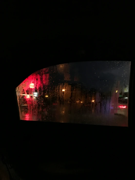 the image shows the back window of a car that is looking through