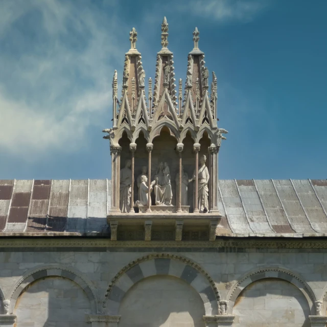 a building with many statues on the top of it