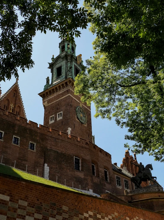 the clock tower sits in the middle of the trees