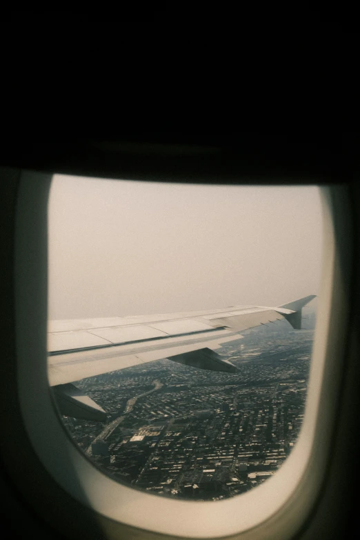 an airplane window showing a view from inside