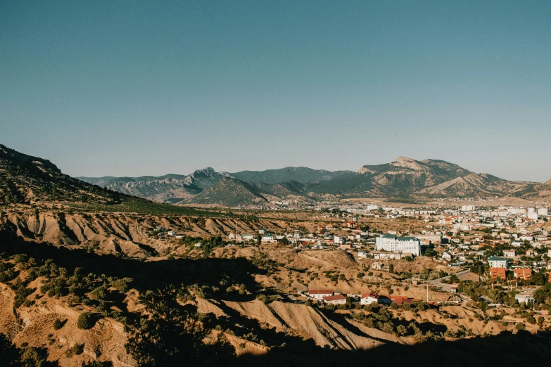 a village with mountains in the distance