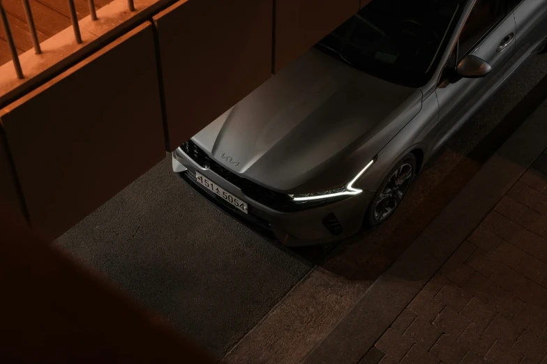 a car parked next to a stairway at night