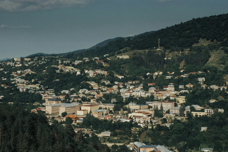 a view of some small towns on top of mountains