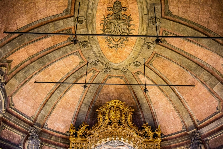 a building with an elaborate gold and white clock