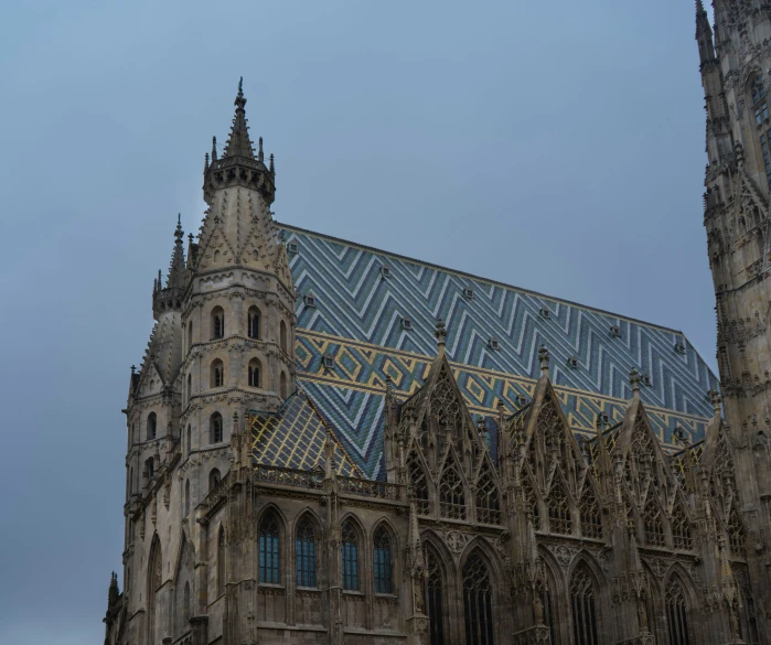 an ornate building has a tall blue roof