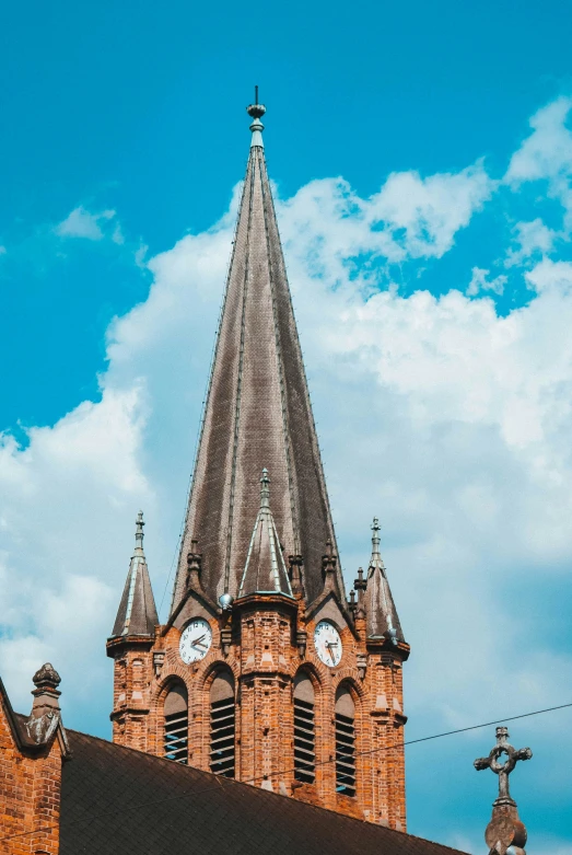 an ornate church spire with clocks on the top