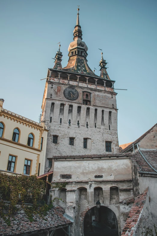 a view of an old building with a clock tower on top