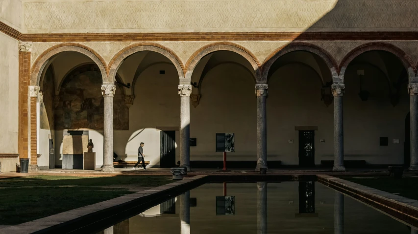 large brick arches holding up water and statues