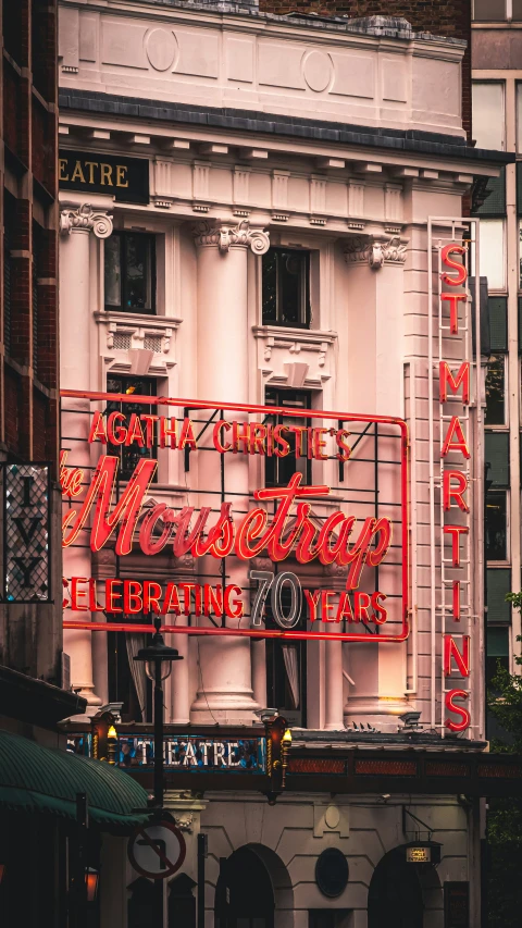 a group of people are standing next to a large building