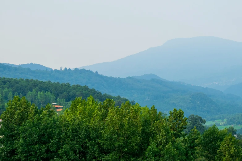 a view of mountains with the top on them, from below