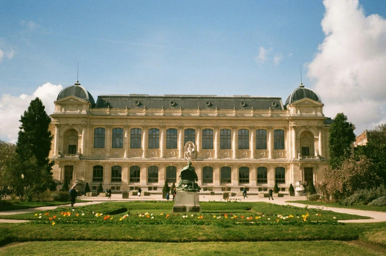 a large building with a statue in front of it