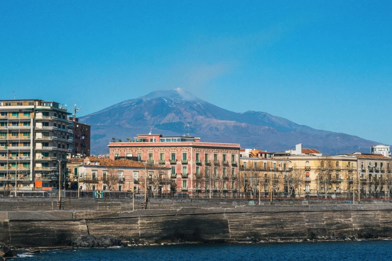 a group of large buildings near the river