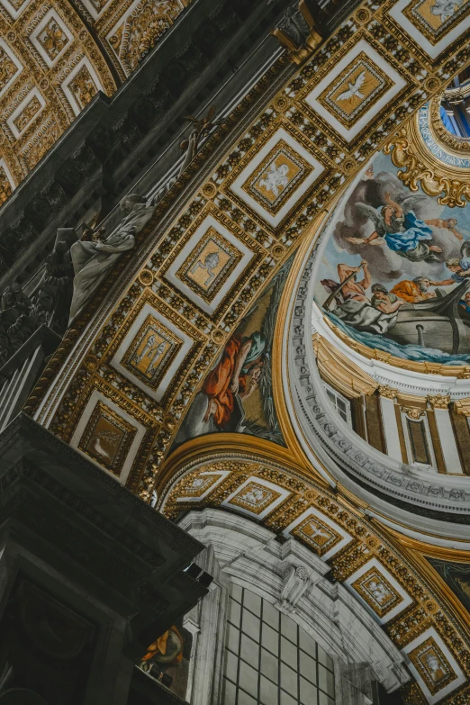 ornate ceilings in the dome of the building