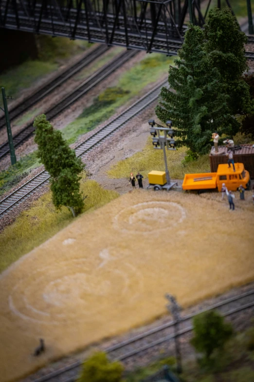 a truck and people on tracks near rail road tracks