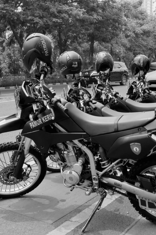 several motorcycles are lined up parked in a row