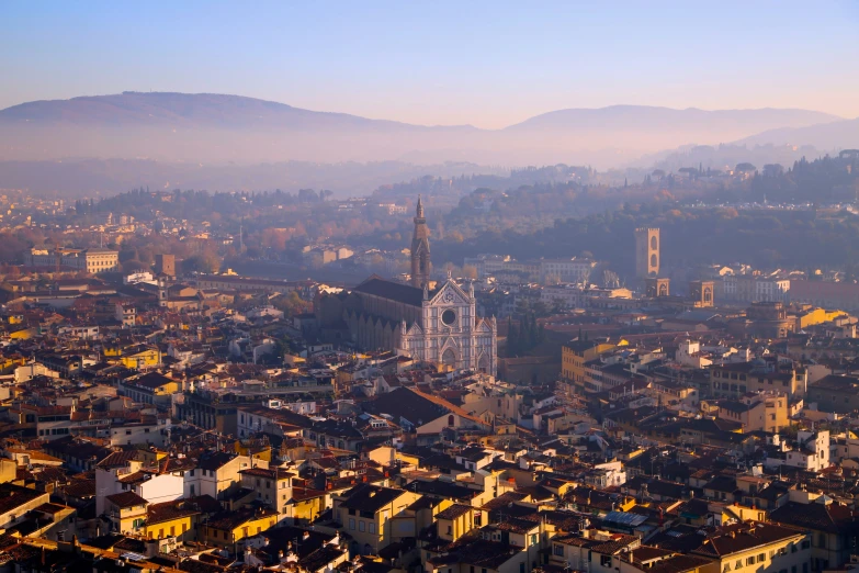 the city is covered in haze and low light