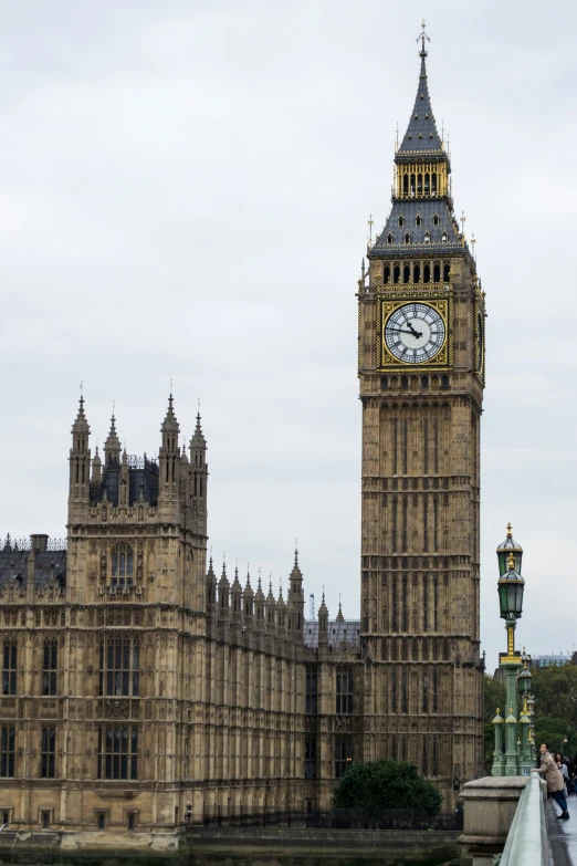 a tall clock tower sitting in the middle of a city