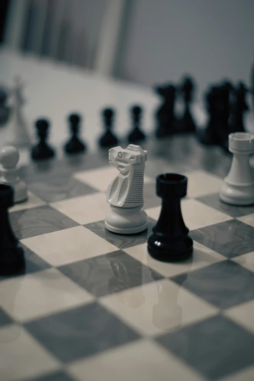 the white pawn stands tall as all of the black pieces