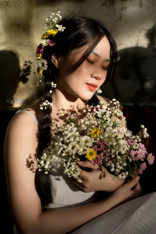 a young woman with flowers in her hair is shown holding a bouquet