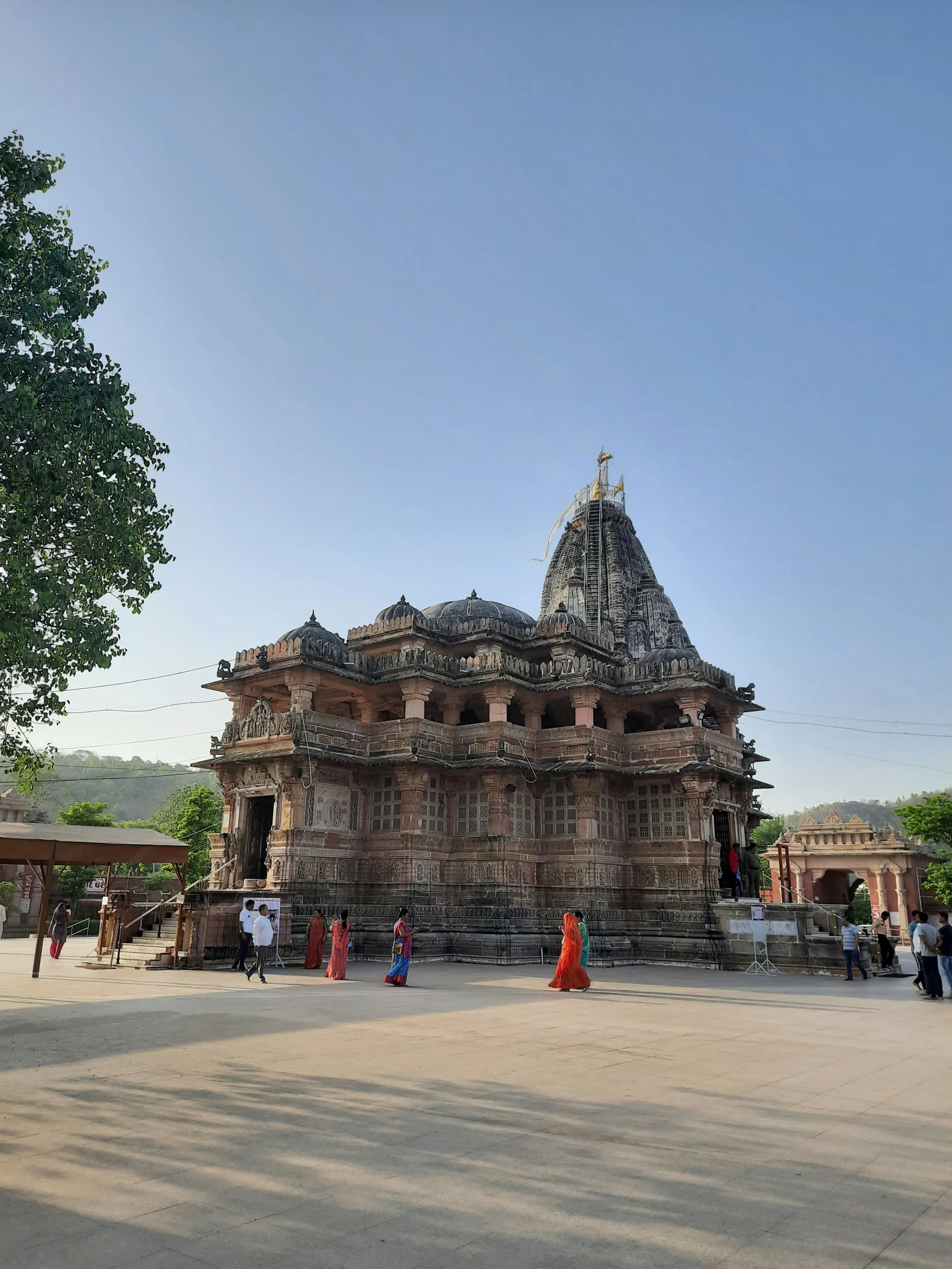 people standing in front of a stone structure