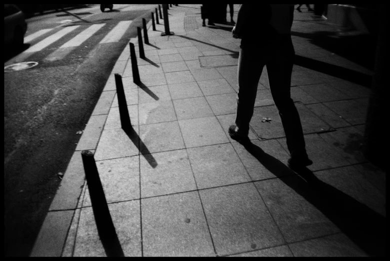 a person with their back to the camera walking down a street