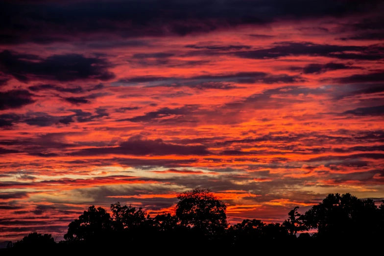 a colorful sky with the sun coming up