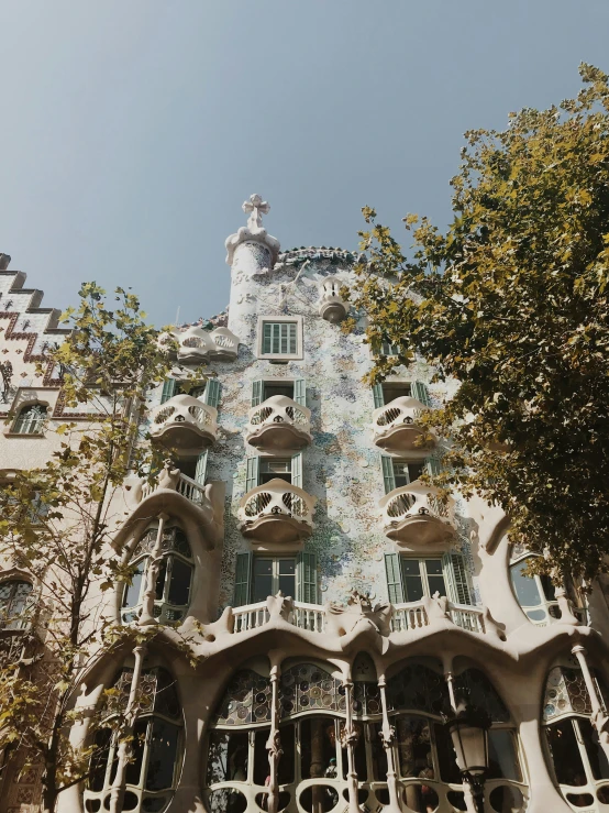 a building with an unusual front facade with many windows