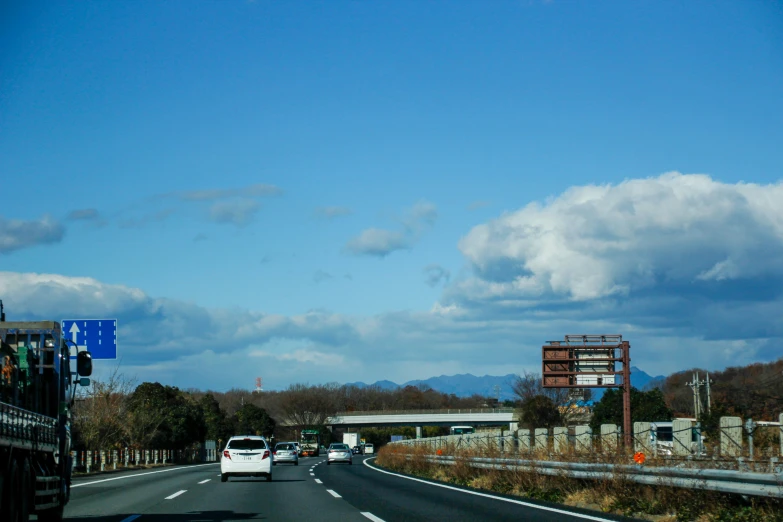 the highway has cars on it and people on it