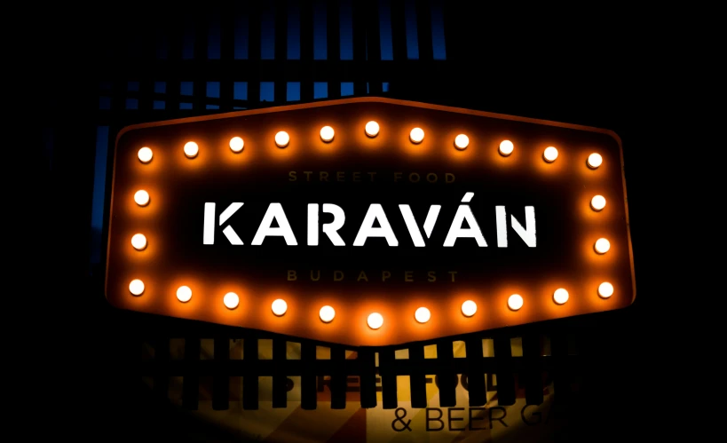 a lighted street sign with the name karravan on it