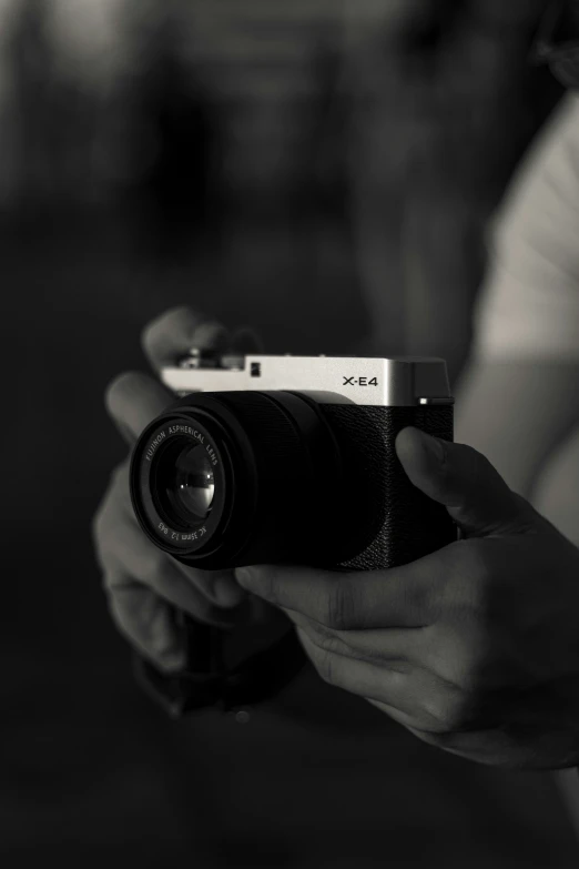 a woman is holding a camera and taking a po