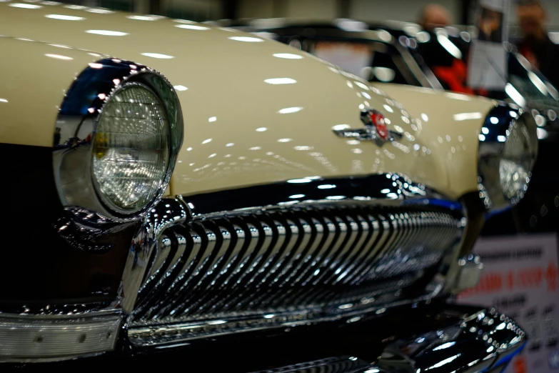 the hood and front grills of a vintage car