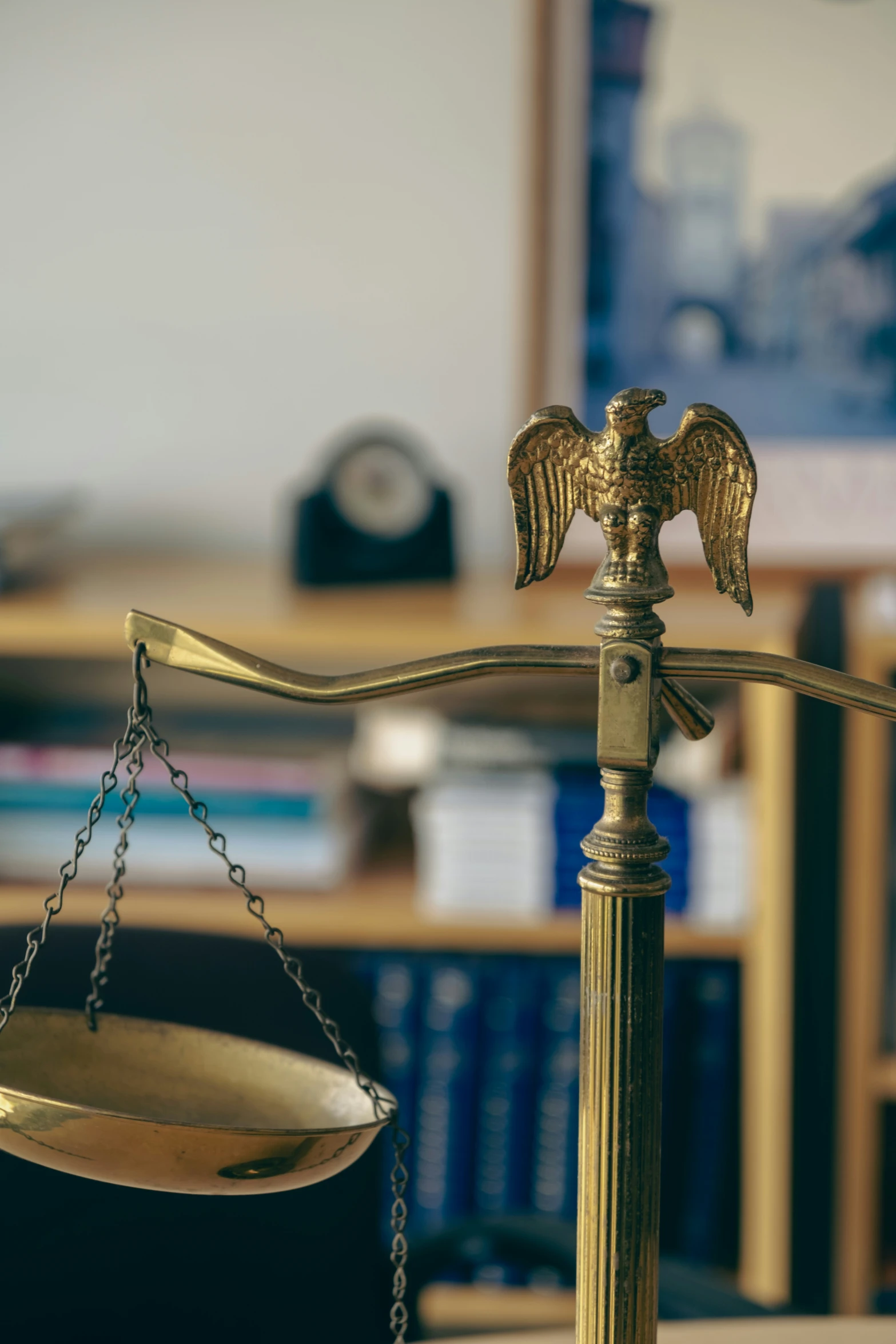 a golden bird on the balance of a weighing device