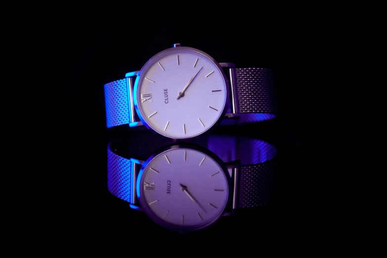 two watches sitting on top of each other