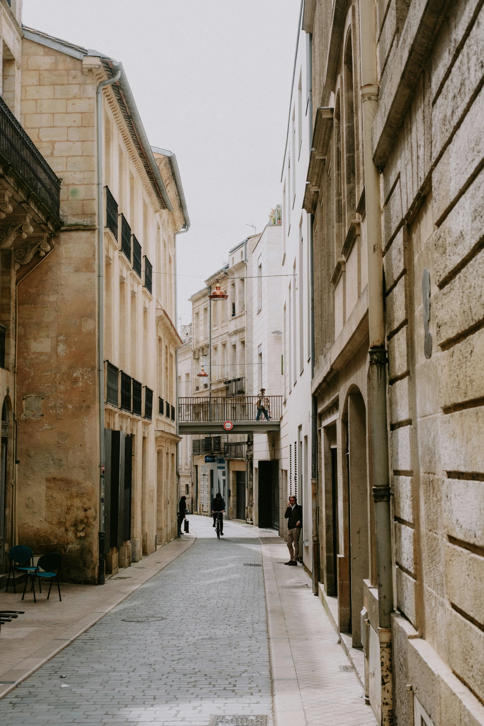 the street in the old town with people walking