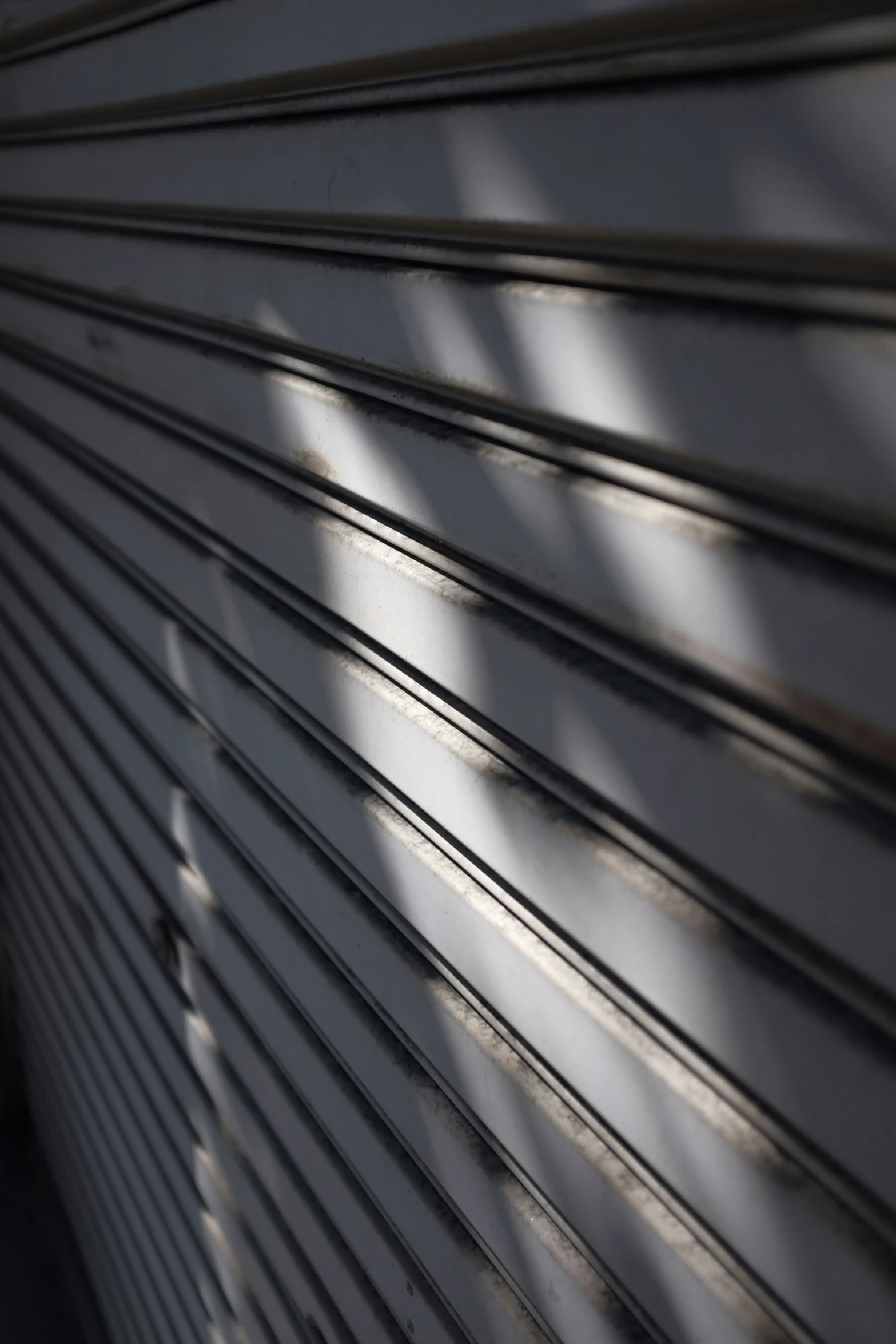 a close up of a closed shutter on a building